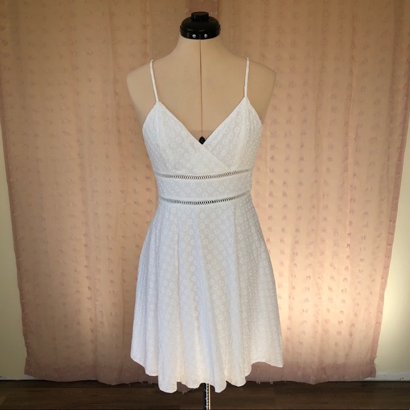 Francesca's Collections Dresses & Skirts - Francesca’s white floral pattern, ladder trim mini dress